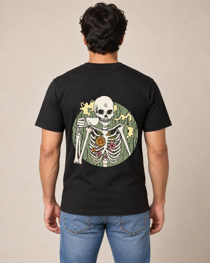 Man modeling black T-shirt back with coffee-drinking skeleton with flowers graphic