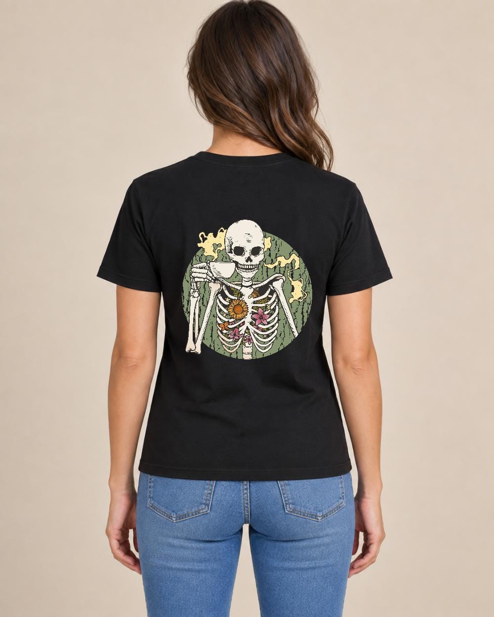 Woman modeling black T-shirt back with coffee-drinking skeleton with flowers graphic