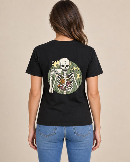 Woman modeling black T-shirt back with coffee-drinking skeleton with flowers graphic